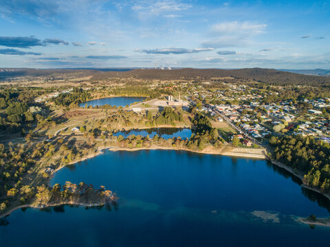 Aerial view over old quarry now a lake and Portland Cement Works 