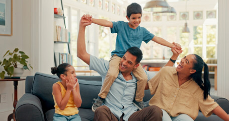 Together on sofa, family and children on dad shoulders for fun, bonding or quality time in living...