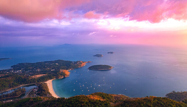 Aerial view photo Thailand , sunset Rawai, Nai Harn beach with white boat and yacht of Phuket above. Amazing Travel thai concept