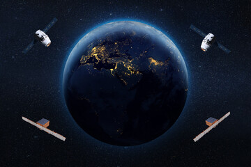 Satellites in low-Earth orbit. Elements of this image furnished by NASA.