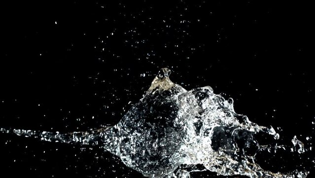 Super slow motion ball bursts with splashes of water. . High quality FullHD footage