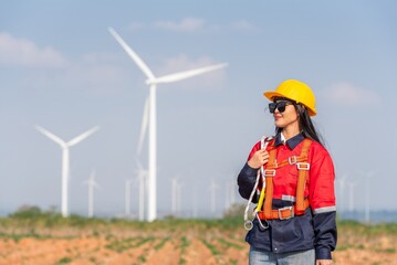 Woman engineer inspection check control wind power machine construction installation in wind energy...