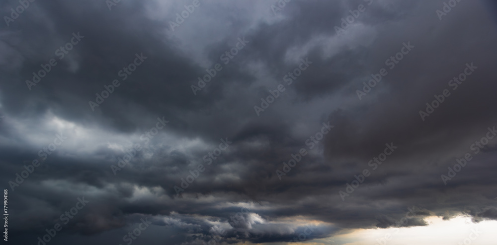 Aufkleber The dark sky with heavy clouds converging and a violent storm before the rain.Bad or moody weather sky and environment. carbon dioxide emissions, greenhouse effect, global warming, climate change.