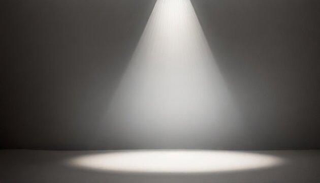 Defocused view on empty studio background lit from top by round spotlight. Visible light cone. Place for displaying product