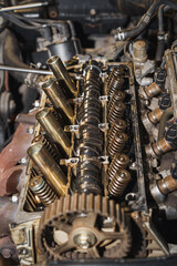Close up of a car engine. Cylinder head. Valve. Valve springs. Sixteen valves. Car repairing. Auto service.