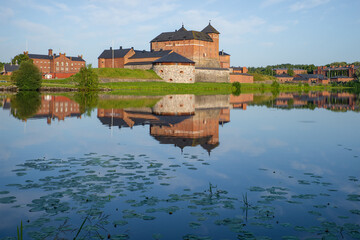 Naklejka na ściany i meble View of the ancient fortress of the Hameenlinna city on a sunny July morning. Finland