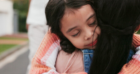 Child, mother and hug outdoor with love and care on a road for security and comfort. Face of a young girl kid and woman or family embrace while together for trust, belonging or attention on a street