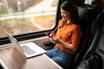 woman using a laptop on the train
