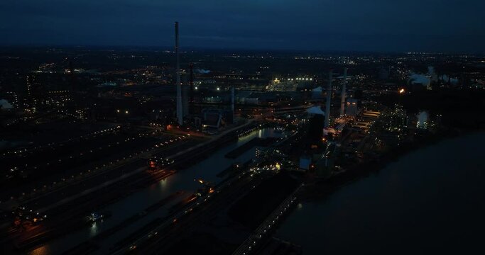 Aerial drone view on the Duisburg cokes factory. Industrial plant in the metal industry. german Ruhr area, production of cokes. Night time view. Germany.
