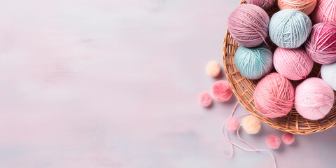 Flat lay. A basket with balls of wool threads with space for text - obrazy, fototapety, plakaty