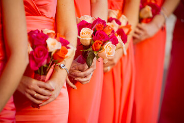 Bridesmaid holding rose bouquet