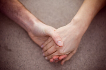 Couple holding hands isolated