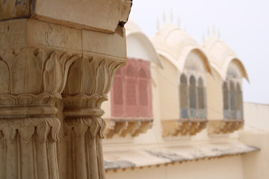 Carving details on the outer wall of Shri Ahilyeshwar Mandir, located in the Ahilya Devi Fort complex on the banks of the River Narmada in Maheshwar, Madhya Pradesh, India