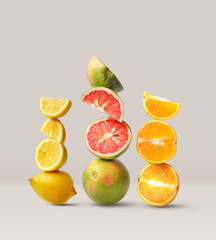 Creative layout made of grapefruit, orange fruit and lemon on the beige background. Food concept. Macro concept.