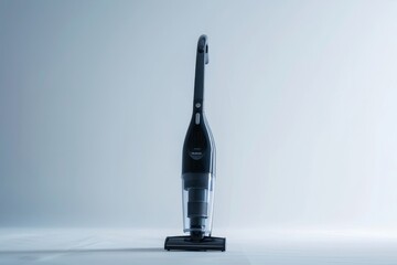 Modern cordless handheld vacuum cleaner standing upright on a clean surface