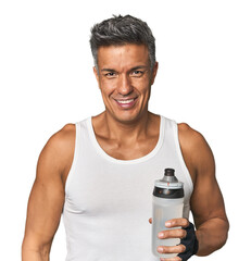 Gym-ready Hispanic man with water bottle happy, smiling and cheerful.