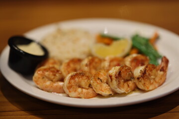 Shrimp and rice dish on a white plate