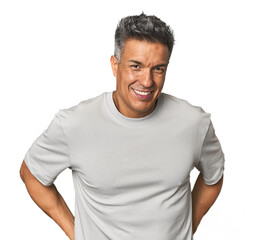 Middle-aged Latino man happy, smiling and cheerful.