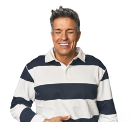 Middle-aged Latino man touches tummy, smiles gently, eating and satisfaction concept.