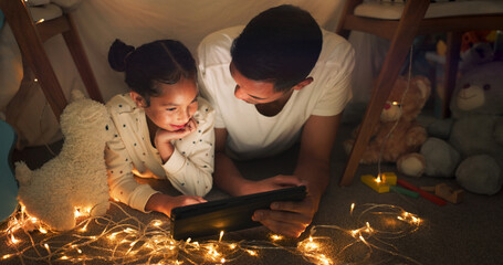 Tent, father and girl on tablet at night watching movies, online games and cartoon with fairy...
