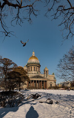 Snow-covered Park in front of St. Isaac's Cathedral in St. Petersburg - Russia in the spring sun