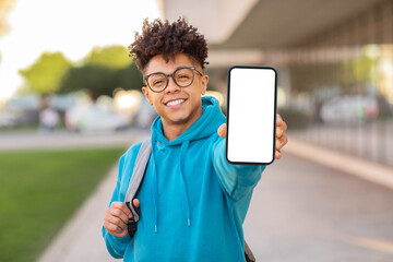 Student showing smartphone screen, mockup copy space