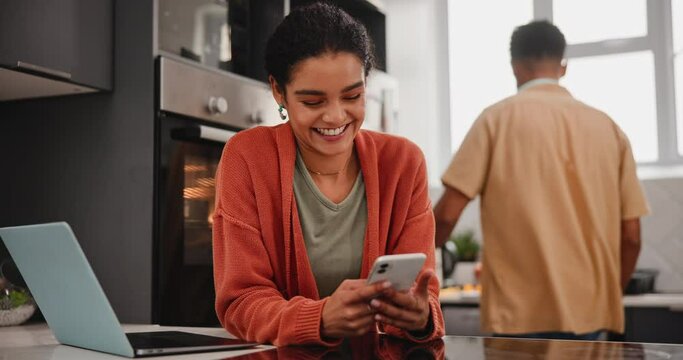Couple, phone and talking in kitchen of new home, internet and subscription service with laptop for recipe or blog. Young man and woman on mobile for online search of tips cooking or meal prep ideas