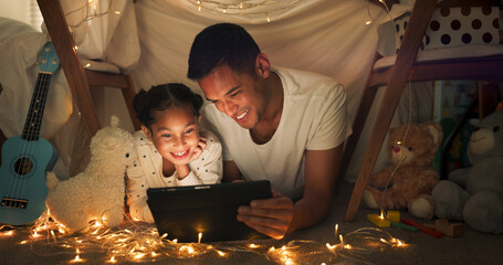 Tent, father and girl on tablet at night watching movies, online games and bedtime story with fairy...