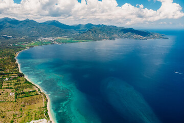 Lombok coastline with beach and blue ocean, aerial view. - 779953763