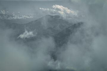 Bright panorama of the cloudy Andes Mountains from the Cerro las Nubes, Mount of the Clouds, in...