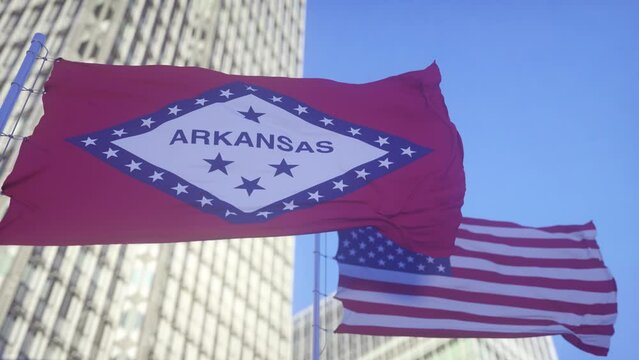 Arkansas and American Flag waving in sky. High detailed waving flag of Arkansas and USA. Arkansas state flag