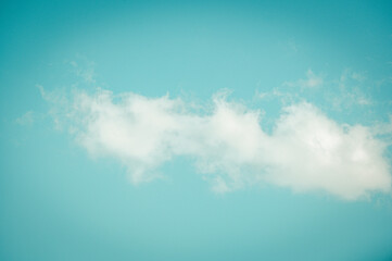 Single cloud in front of turquoise sky