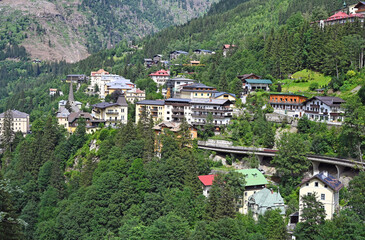 Buildings in the forest on the mountain Bad Gastein summer season - 779968550