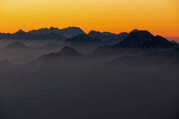 Panoramic sunrise view from Dobratsch on the Julian Alps and Karawanks in Austria, Europe....