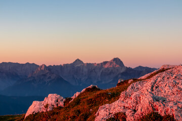 Selective close up view of rocks looking at sunset from Dobratsch on Julian Alps and Karawanks in...