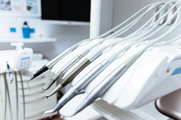A dental office with a variety of dental instruments on a table