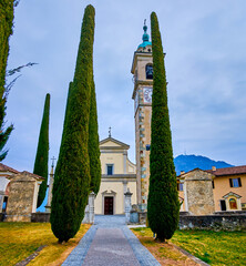 The alley with tall cypress trees at Sant'Abbondio Church, Collina d'Oro, Switzerland