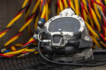 Photo of a commercial dive helmet on the ground - 779987763
