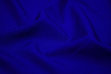 Blue fabric closeup. Plexus threads. Clothing industry. Abstract background. Textile waves. - obrazy, fototapety, plakaty