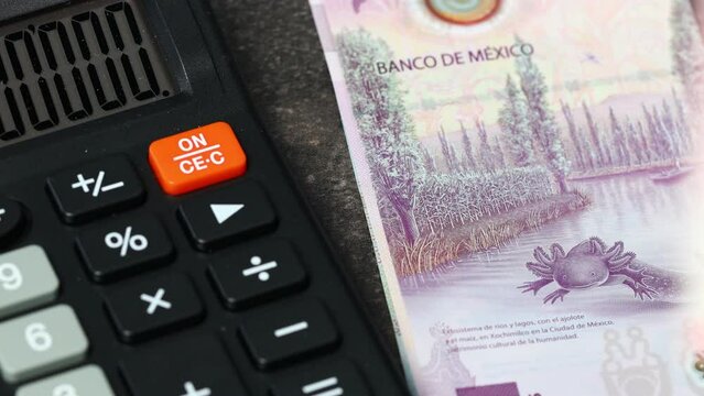 Mexico money, financial settlements, Calculator and money counting, Mexican pesos