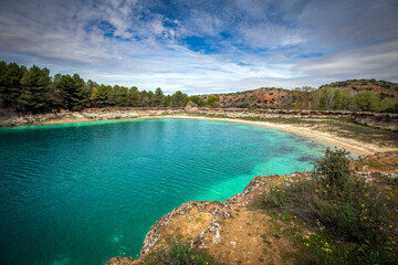 View of the Lengua lagoon in the Lagunas de Ruidera, Albacete, Castilla La Mancha, Spain, with an intense color and little water due to the pressing drought