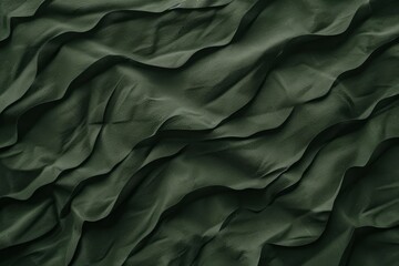   A detailed view of a green fabric, featuring undulating lines at its upper and lower edges - obrazy, fototapety, plakaty