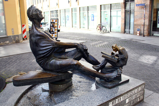Halle, Germany - April 6, 2024: The Zither Reinhold Fountain in Halle on Leipziger Strasse. Reinhold Lohse was a Halle street musician and city original.
