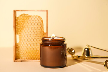 Honey Сandle with Рoneycomb. Honey wax. Candle Care. Spa still life - obrazy, fototapety, plakaty