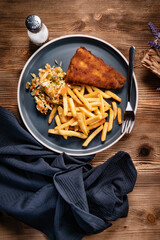 Fried cod fillet with fries and salad. - 780000107