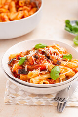 plate of pasta alla norma, classic traditional Italian eggplant and tomato pasta