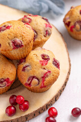 dried cranberry muffins on a wooden table