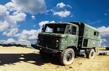 Obraz premium A damaged military truck on the battlefield. military technics.