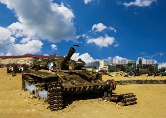 Damaged tanks, armored vehicles and equipment on the battlefield. military technics. Wide image for...