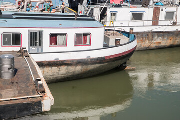 Fototapeta na wymiar Vintage river ships anchored at river port closeup on sunny day
